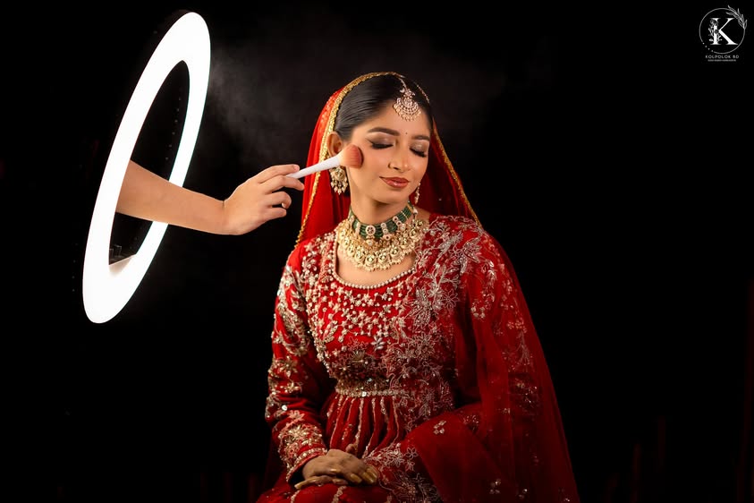 Bride having her makeup finished