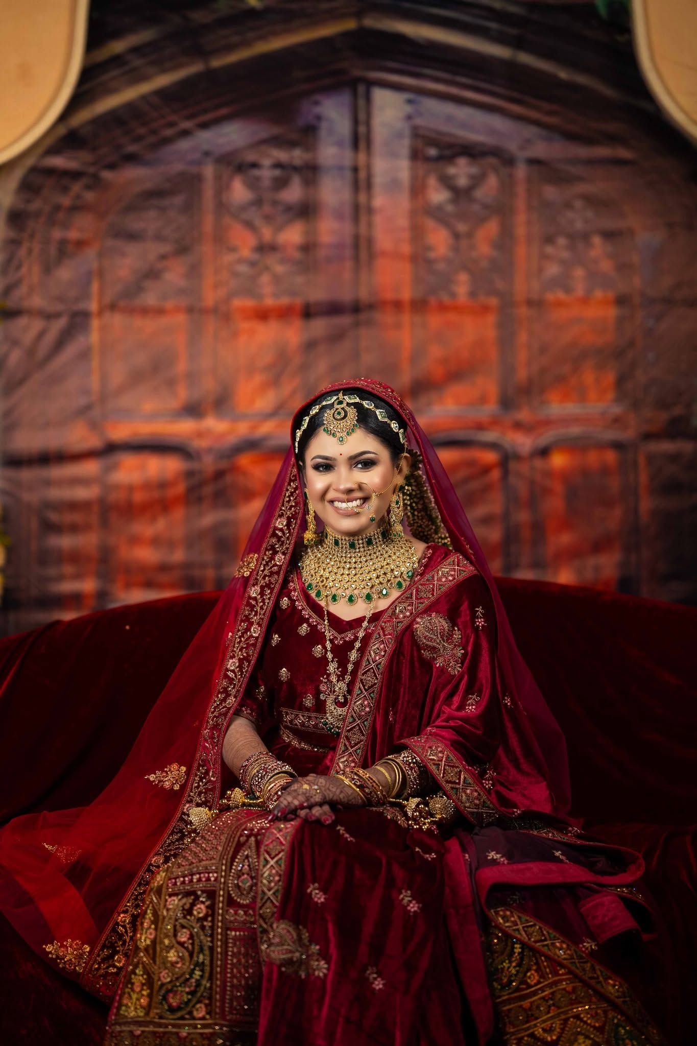 Bride in burgundy wedding attire
